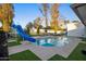 Refreshing blue pool with a slide, surrounded by artificial turf at 8614 E Appaloosa Trl, Scottsdale, AZ 85258