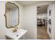 Convenient powder room with a pedestal sink and view of the dining area at 8614 E Appaloosa Trl, Scottsdale, AZ 85258