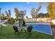 Private backyard sports court with basketball and tennis areas at 8614 E Appaloosa Trl, Scottsdale, AZ 85258