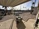 Gravel backyard with AC unit and view of community amenities at 9302 E Broadway Rd # 24, Mesa, AZ 85208