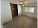 Bedroom with wood-look flooring and a large closet at 9302 E Broadway Rd # 24, Mesa, AZ 85208