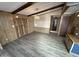 Dining area with wood-look floors and exposed beams at 9302 E Broadway Rd # 24, Mesa, AZ 85208