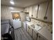 Laundry room with washer, dryer, and cabinets at 9302 E Broadway Rd # 24, Mesa, AZ 85208