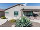 Landscaped backyard with covered patio and built-in grill at 10359 E Morning Star Dr, Scottsdale, AZ 85255