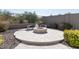 Relaxing backyard patio with fire pit and seating area at 10359 E Morning Star Dr, Scottsdale, AZ 85255