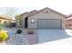 Single-story home with a two-car garage and desert landscaping at 10359 E Morning Star Dr, Scottsdale, AZ 85255