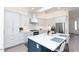 Bright kitchen featuring white cabinets, a center island, and stainless steel appliances at 10359 E Morning Star Dr, Scottsdale, AZ 85255