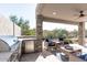 Outdoor kitchen with grill and refrigerator at 10359 E Morning Star Dr, Scottsdale, AZ 85255