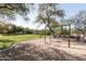 Playground with swings and wood chips at 10359 E Morning Star Dr, Scottsdale, AZ 85255