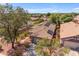 House with solar panels on the roof, showcasing a neighborhood view at 10387 W Runion Dr, Peoria, AZ 85382