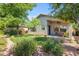 Spacious backyard with covered patio and grassy area at 10387 W Runion Dr, Peoria, AZ 85382