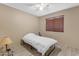 Cozy bedroom with wood flooring and a window with blinds at 10387 W Runion Dr, Peoria, AZ 85382