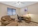 Home office featuring a comfortable armchair and work desk at 10387 W Runion Dr, Peoria, AZ 85382