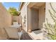 Small patio with a table and chairs, adjacent to the house entrance at 10387 W Runion Dr, Peoria, AZ 85382