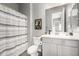 Bathroom with shower and gray vanity at 10712 E Trillium Ave, Mesa, AZ 85212