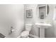 Elegant powder room with pedestal sink, and contemporary decor at 10712 E Trillium Ave, Mesa, AZ 85212