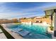 Inviting pool and spa with plenty of lounge space at 10712 E Trillium Ave, Mesa, AZ 85212