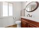 Bathroom with new vanity, toilet, and window at 10714 W Saratoga Cir, Sun City, AZ 85351