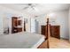 Main bedroom with dresser and en-suite bathroom access at 10714 W Saratoga Cir, Sun City, AZ 85351