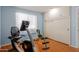 Bright room with exercise equipment, including stationary bike at 10714 W Saratoga Cir, Sun City, AZ 85351