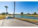 Landscaped golf course with a pond and walking path at 10714 W Saratoga Cir, Sun City, AZ 85351