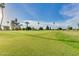 Sunny day view of a lush green golf course at 10714 W Saratoga Cir, Sun City, AZ 85351