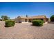 Back exterior view of single story house with a small yard at 10714 W Saratoga Cir, Sun City, AZ 85351