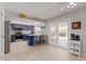 Modern kitchen with blue cabinets and island seating at 10714 W Saratoga Cir, Sun City, AZ 85351