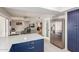 Kitchen with island, stainless steel refrigerator, and view into living room at 10714 W Saratoga Cir, Sun City, AZ 85351