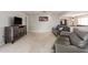 Living room with gray leather sofas and hardwood floors at 10714 W Saratoga Cir, Sun City, AZ 85351