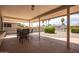 Covered patio with seating area and view of backyard at 10714 W Saratoga Cir, Sun City, AZ 85351