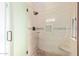 Large walk-in shower with tiled walls and glass door at 10714 W Saratoga Cir, Sun City, AZ 85351