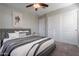 Serene bedroom with gray bedding and ample closet space at 1080 S 151St Ln, Goodyear, AZ 85338