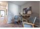 Hallway with two armchairs, console table, and artwork at 1080 S 151St Ln, Goodyear, AZ 85338