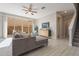 Living room with sectional sofa, hardwood floors, and a view of the backyard at 1080 S 151St Ln, Goodyear, AZ 85338