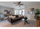 Upstairs loft area with seating and a ceiling fan at 1080 S 151St Ln, Goodyear, AZ 85338