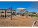 Community playground with swings and play structures at 1080 S 151St Ln, Goodyear, AZ 85338