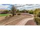 Landscaped backyard with a brick pathway and desert landscaping at 10949 W Sierra Pinta Dr, Peoria, AZ 85373