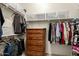 Walk-in closet with shelving and dresser at 10949 W Sierra Pinta Dr, Peoria, AZ 85373