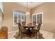 Charming dining area with a table for four and window seating at 10949 W Sierra Pinta Dr, Peoria, AZ 85373