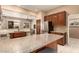 Open kitchen with granite countertops and ample cabinetry at 10949 W Sierra Pinta Dr, Peoria, AZ 85373