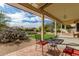 Covered patio with seating area overlooking the backyard at 10949 W Sierra Pinta Dr, Peoria, AZ 85373