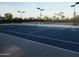 Two well-maintained tennis courts with surrounding landscape at 10949 W Sierra Pinta Dr, Peoria, AZ 85373