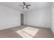 Bright bedroom with ceiling fan and carpet flooring at 11005 E Texas Ave, Mesa, AZ 85212