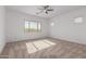 Spacious bedroom with ceiling fan and neutral carpet at 11005 E Texas Ave, Mesa, AZ 85212