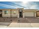 Single-story home with a two-car garage and landscaped front yard at 11005 E Texas Ave, Mesa, AZ 85212