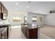 Spacious kitchen with an island that overlooks the living room at 11005 E Texas Ave, Mesa, AZ 85212