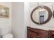 Elegant bathroom with a large vanity and decorative mirror at 11163 W Elm Ln, Avondale, AZ 85323