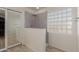 Bathroom with walk-in shower and glass block window at 11163 W Elm Ln, Avondale, AZ 85323