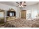 Main bedroom with large TV and ensuite bathroom access at 11163 W Elm Ln, Avondale, AZ 85323